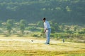 Golfer sport course golf ball fairway.ÃÂ  People lifestyle man playing game golf tee off on the green grass. Royalty Free Stock Photo